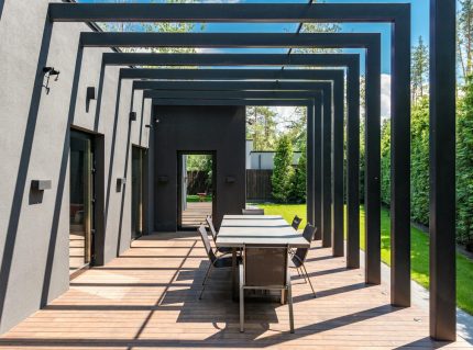 Outdoor pergola with open lattice roof over a backyard patio in New Orleans Louisiana