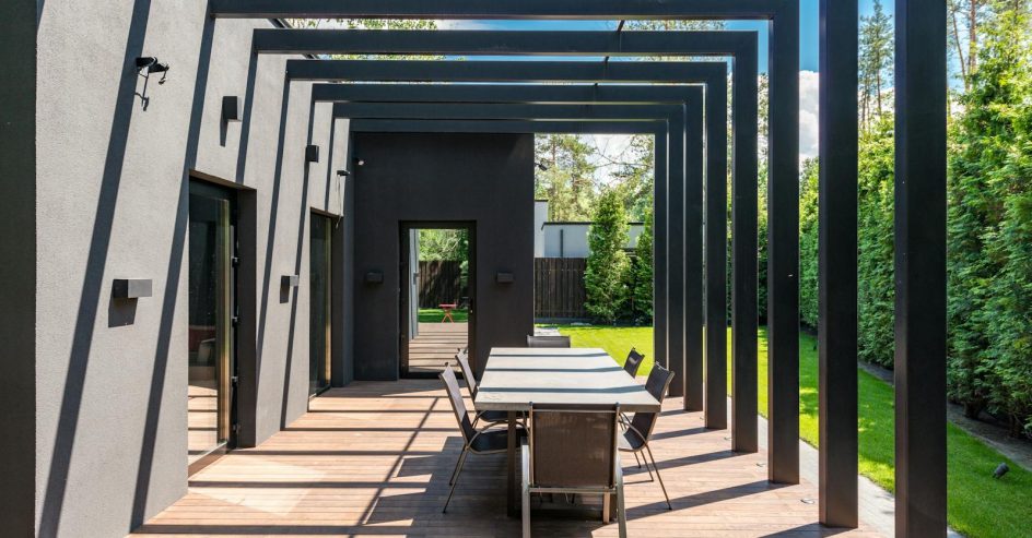 Outdoor pergola with open lattice roof over a backyard patio in New Orleans Louisiana